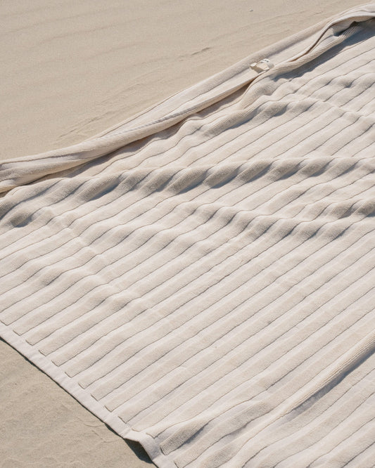 Dunes cotton towel laid out on sand