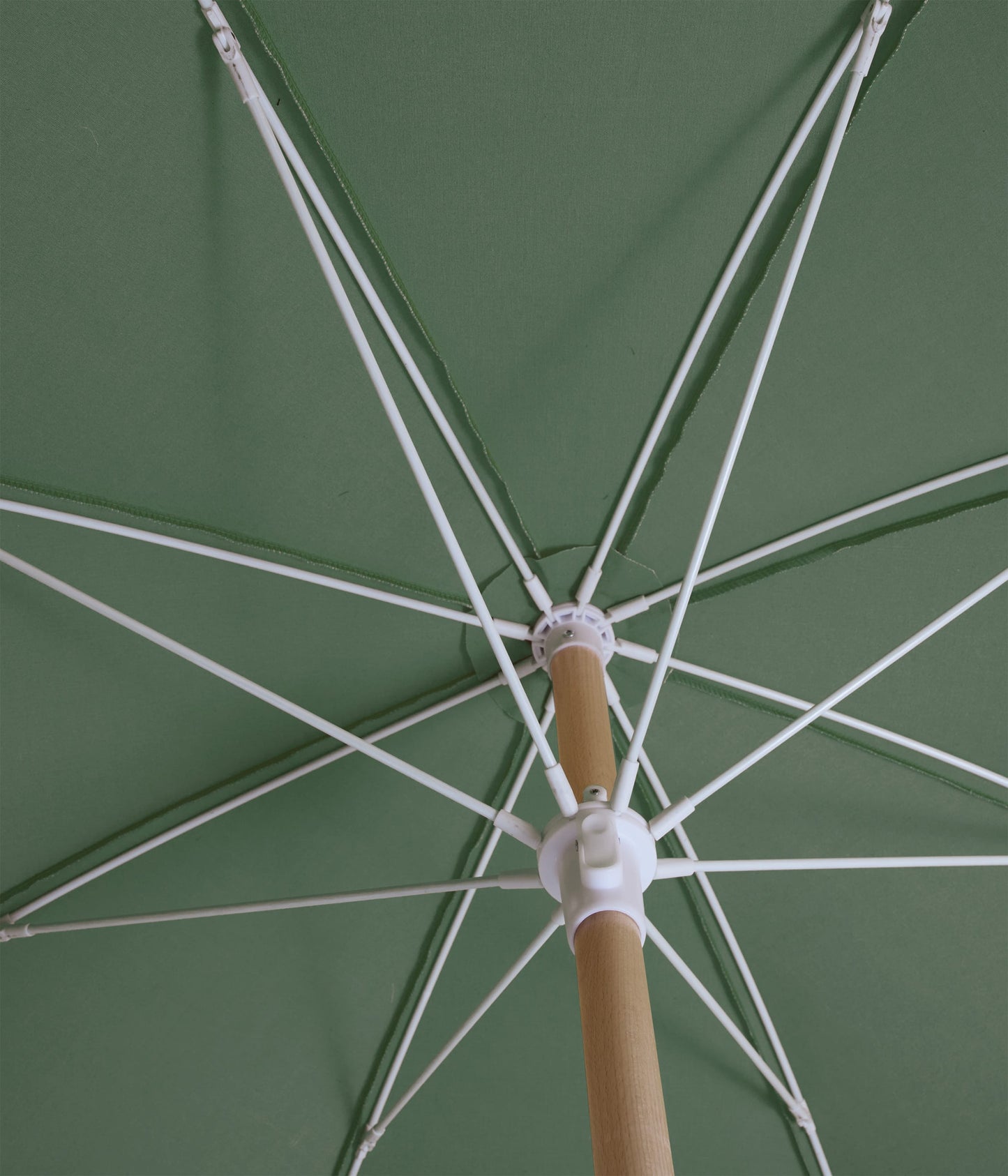 Sunday Supply Co Tallow beach umbrella open and seen from underneath.